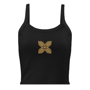 May include: Black cropped tank top with a gold floral design.