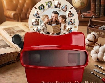 May include: A red View-Master toy with a personalised photo reel. The reel features family photos and the text "Happy Father's Day, Dad! We Love You." The base of the View-Master has the text "Personalized with Your Photos."