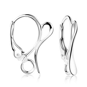 May include: A pair of shiny, silver-colored leverback earring findings. The earrings have a curved design with a loop for attaching a charm or bead. The leverback closure is visible on each earring.