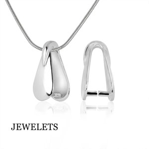 May include: A silver-colored pendant with a teardrop design, suspended from a thin chain. The pendant is smooth and reflective, with a matching clasp. The word "JEWELETS" is printed at the bottom.