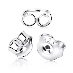 May include: Silver earring backs with a 925 stamp. The backs are designed to secure earrings in place.