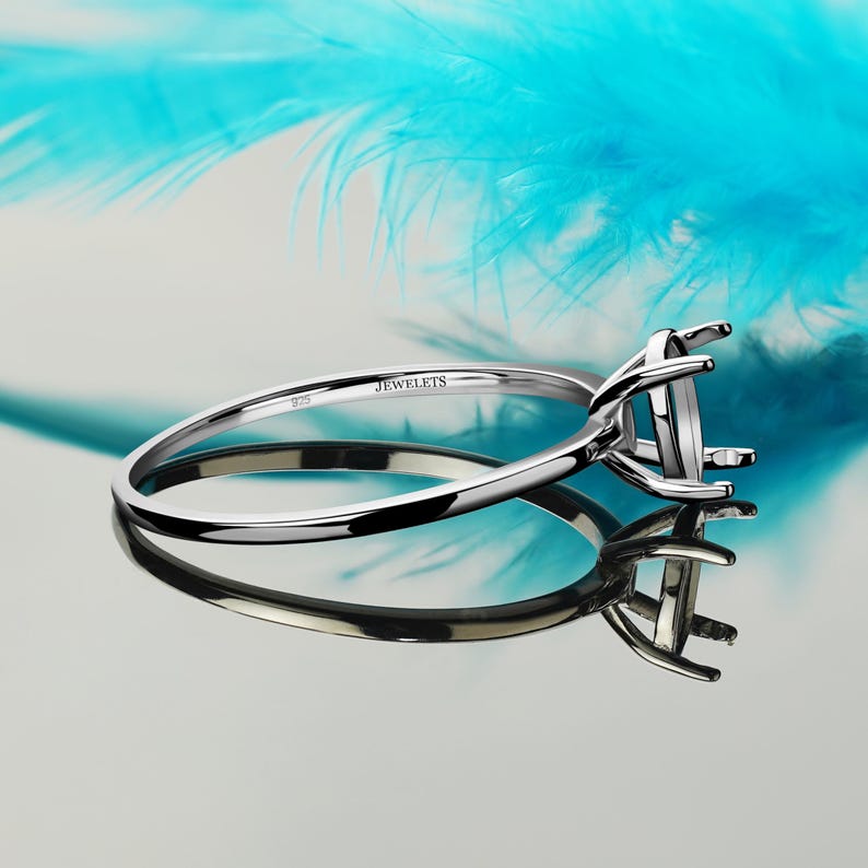 Sterling silver ring blank 6x8mm classic basket prong setting rhodium plated silver ring base. Basket setting ring blank for gemstones or cabochons.
Classic silver ring blank with prong mount for DIY jewelry making.