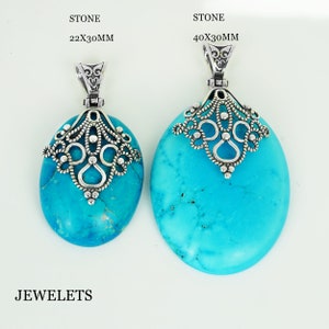 May include: Two turquoise oval pendants with silver filigree designs. The larger pendant is 40x30mm and the smaller pendant is 22x30mm. The text "STONE" and the measurements are printed above each pendant.