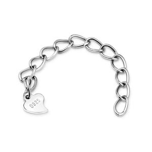 May include: A silver chain bracelet with a heart-shaped charm that has the number "925" engraved on it.