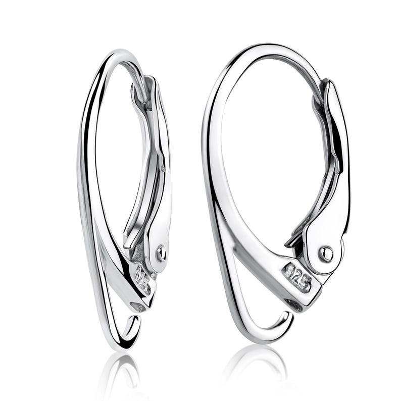Genuine sterling silver leverback ear wires featuring a secure locking mechanism for everyday wear. Professional jewelry making components suitable for pearls, gemstones, and custom earrings.