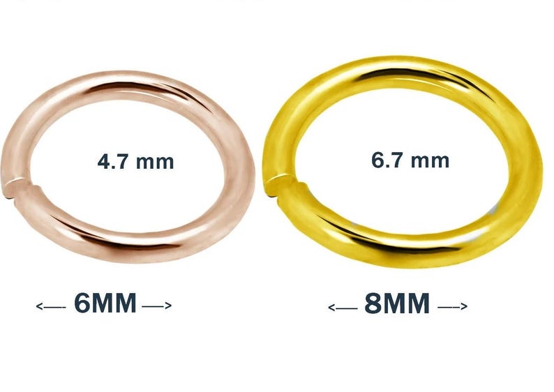 Macro image of open gold jump rings, clearly showing clean cuts and high-polish finish – essential jewelry hardware for attaching clasps and charms. Jewelry making supplies featuring solid gold and platinum jump rings – strong, elegant, and ideal for use in fine jewelry design and restoration projects. Artisan workspace photo with 14K gold jump rings placed next to tools and chain links – demonstrating their practical use in custom jewelry creation.