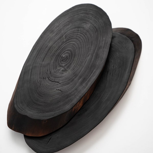 Charred wood serving board. Yakisugi burnt wood. Live edge birch wood serving boards. Minimalist design. Stylish kitchen. Black wood slice.