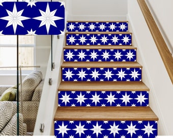 May include: A set of white star-shaped decals on a blue background, applied to wooden stairs. The decals are arranged in a repeating pattern.