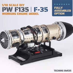 May include: A 1/10 scale DIY PW F135 F-35 working engine model by Teching DM135. The metallic gold and silver cylindrical engine features visible internal components, black wiring, and a black rear nozzle, mounted on a black rectangular base.