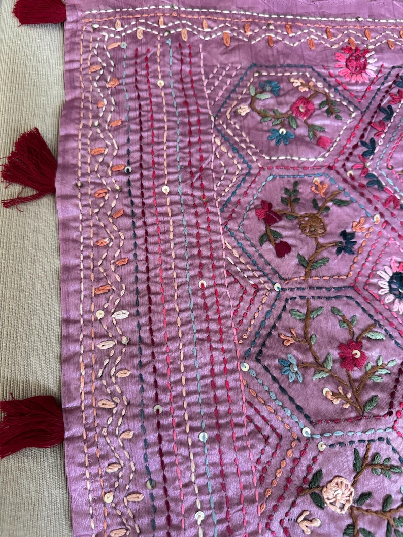 Pink Tussar silk saree featuring intricate Lambani and Kantha floral embroidery, elegant handcrafted ethnic saree with matching blouse piece, perfect for weddings, parties, festive occasions, and traditional celebrations.