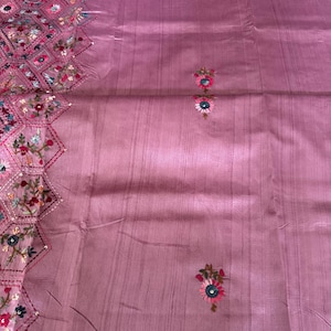 Pink Tussar silk saree featuring intricate Lambani and Kantha floral embroidery, elegant handcrafted ethnic saree with matching blouse piece, perfect for weddings, parties, festive occasions, and traditional celebrations.