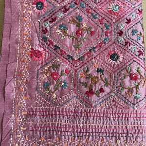 Pink Tussar silk saree featuring intricate Lambani and Kantha floral embroidery, elegant handcrafted ethnic saree with matching blouse piece, perfect for weddings, parties, festive occasions, and traditional celebrations.