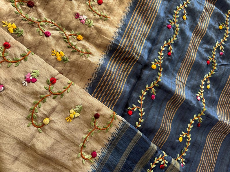 Handcrafted Tussar silk saree featuring delicate French knot embroidery with intricate floral detailing, offering a blend of texture, elegance, and artisanal charm.