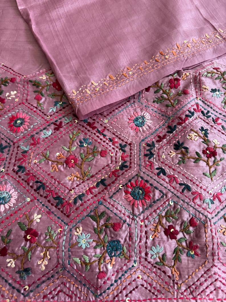 Pink Tussar silk saree featuring intricate Lambani and Kantha floral embroidery, elegant handcrafted ethnic saree with matching blouse piece, perfect for weddings, parties, festive occasions, and traditional celebrations.
