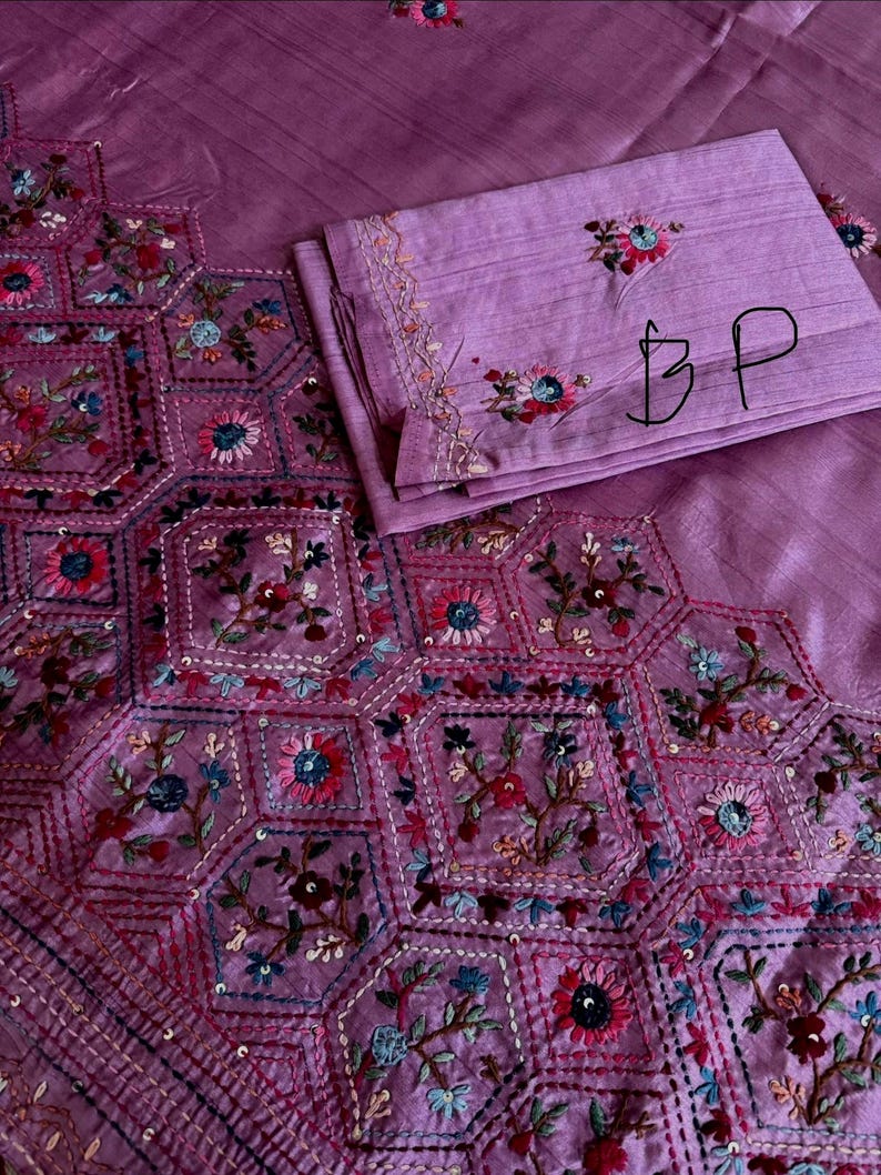 Pink Tussar silk saree featuring intricate Lambani and Kantha floral embroidery, elegant handcrafted ethnic saree with matching blouse piece, perfect for weddings, parties, festive occasions, and traditional celebrations.