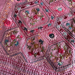 Pink Tussar silk saree featuring intricate Lambani and Kantha floral embroidery, elegant handcrafted ethnic saree with matching blouse piece, perfect for weddings, parties, festive occasions, and traditional celebrations.