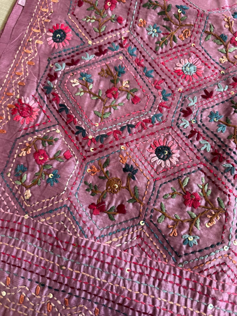Pink Tussar silk saree featuring intricate Lambani and Kantha floral embroidery, elegant handcrafted ethnic saree with matching blouse piece, perfect for weddings, parties, festive occasions, and traditional celebrations.
