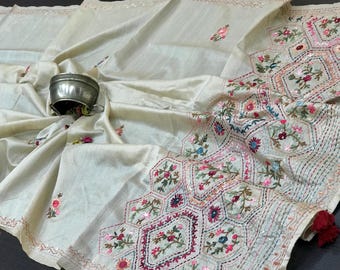 Lambani katha hand embroidery on off white Tussar silk saree: with unstitched blouse piece for Festive wear