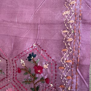 Pink Tussar silk saree featuring intricate Lambani and Kantha floral embroidery, elegant handcrafted ethnic saree with matching blouse piece, perfect for weddings, parties, festive occasions, and traditional celebrations.