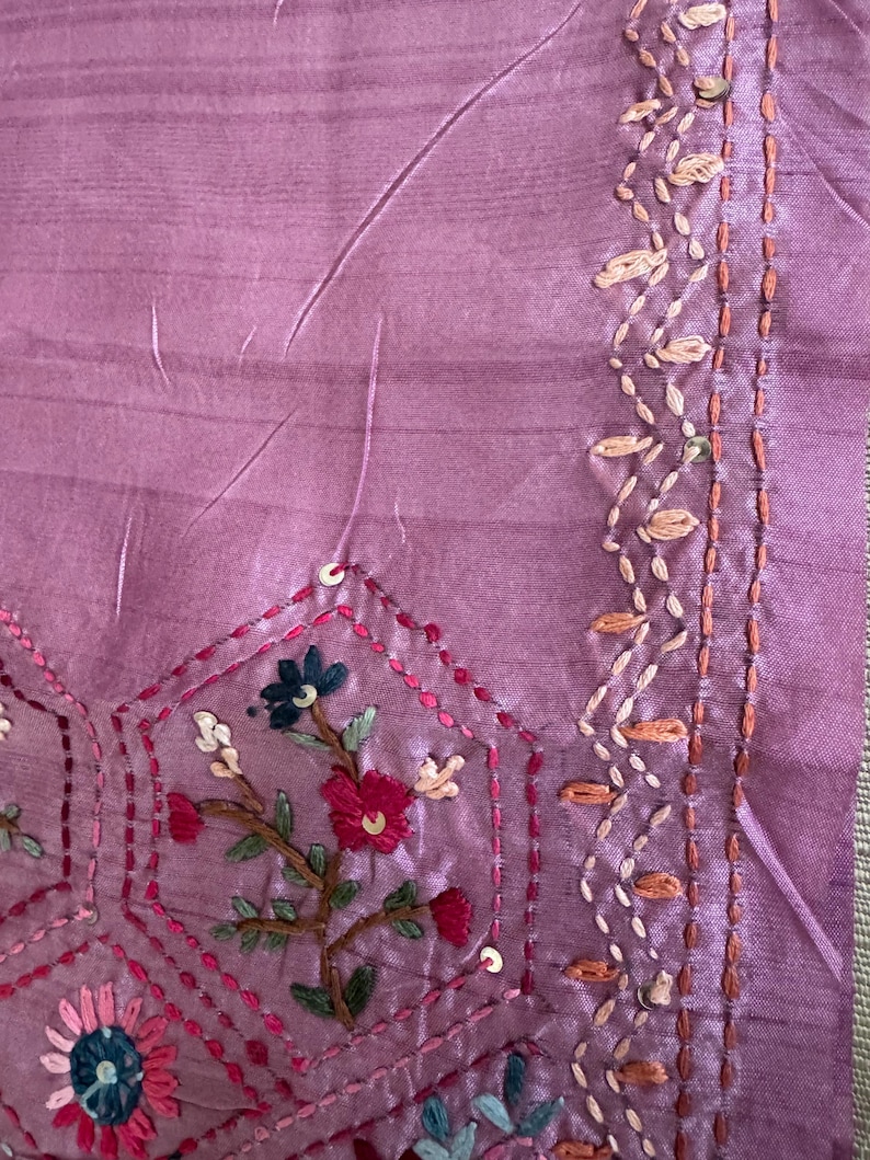 Pink Tussar silk saree featuring intricate Lambani and Kantha floral embroidery, elegant handcrafted ethnic saree with matching blouse piece, perfect for weddings, parties, festive occasions, and traditional celebrations.