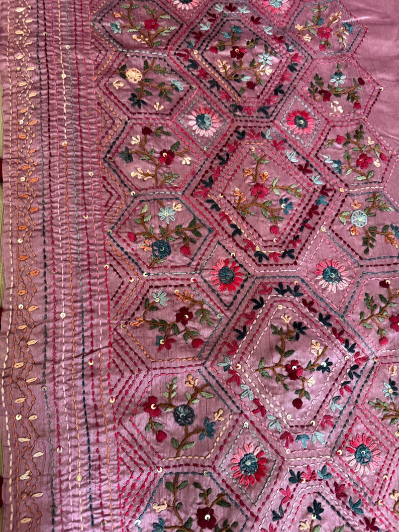 Pink Tussar silk saree featuring intricate Lambani and Kantha floral embroidery, elegant handcrafted ethnic saree with matching blouse piece, perfect for weddings, parties, festive occasions, and traditional celebrations.