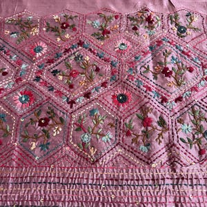 Pink Tussar silk saree featuring intricate Lambani and Kantha floral embroidery, elegant handcrafted ethnic saree with matching blouse piece, perfect for weddings, parties, festive occasions, and traditional celebrations.