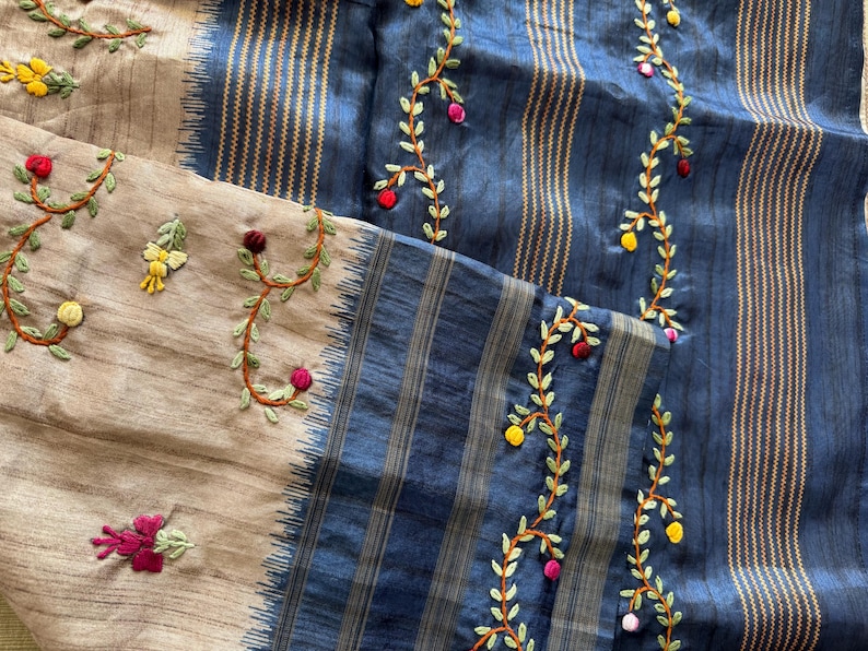 Handcrafted Tussar silk saree featuring delicate French knot embroidery with intricate floral detailing, offering a blend of texture, elegance, and artisanal charm.