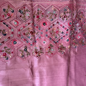 Pink Tussar silk saree featuring intricate Lambani and Kantha floral embroidery, elegant handcrafted ethnic saree with matching blouse piece, perfect for weddings, parties, festive occasions, and traditional celebrations.