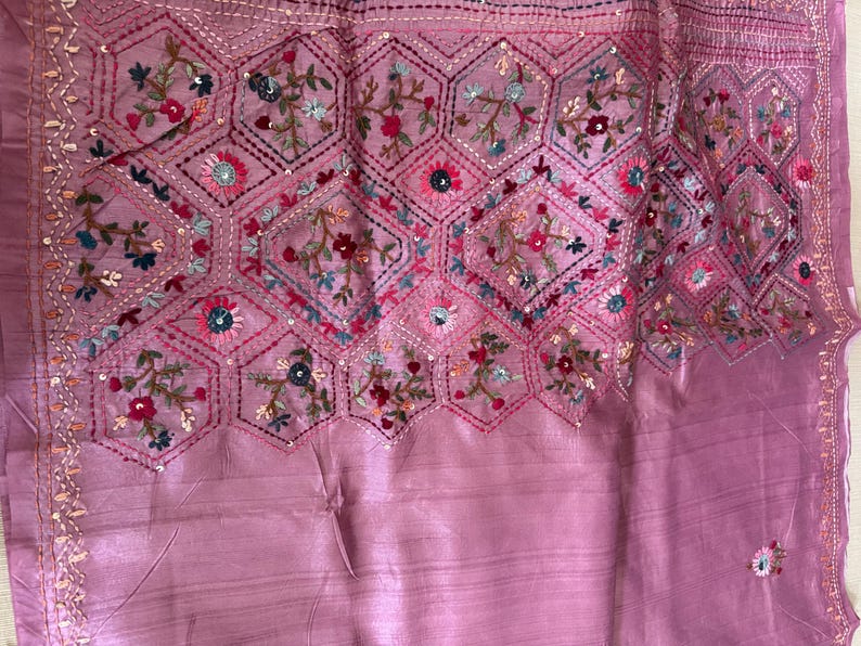 Pink Tussar silk saree featuring intricate Lambani and Kantha floral embroidery, elegant handcrafted ethnic saree with matching blouse piece, perfect for weddings, parties, festive occasions, and traditional celebrations.