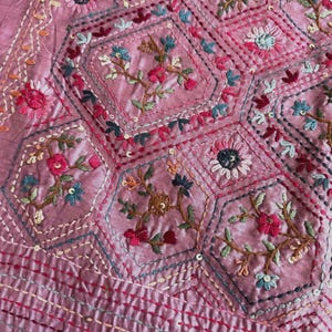 Pink Tussar silk saree featuring intricate Lambani and Kantha floral embroidery, elegant handcrafted ethnic saree with matching blouse piece, perfect for weddings, parties, festive occasions, and traditional celebrations.