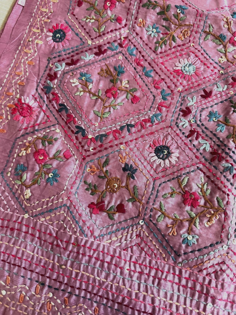 Pink Tussar silk saree featuring intricate Lambani and Kantha floral embroidery, elegant handcrafted ethnic saree with matching blouse piece, perfect for weddings, parties, festive occasions, and traditional celebrations.