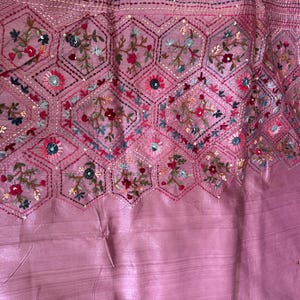 Pink Tussar silk saree featuring intricate Lambani and Kantha floral embroidery, elegant handcrafted ethnic saree with matching blouse piece, perfect for weddings, parties, festive occasions, and traditional celebrations.