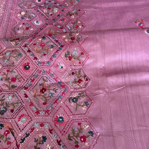 Pink Tussar silk saree featuring intricate Lambani and Kantha floral embroidery, elegant handcrafted ethnic saree with matching blouse piece, perfect for weddings, parties, festive occasions, and traditional celebrations.