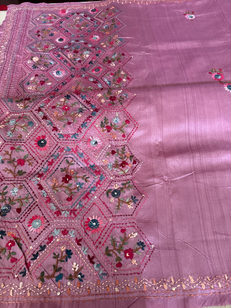 Pink Tussar silk saree featuring intricate Lambani and Kantha floral embroidery, elegant handcrafted ethnic saree with matching blouse piece, perfect for weddings, parties, festive occasions, and traditional celebrations.