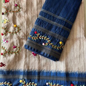 Handcrafted Tussar silk saree featuring delicate French knot embroidery with intricate floral detailing, offering a blend of texture, elegance, and artisanal charm.