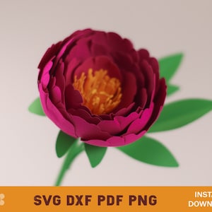 May include: A paper flower with a deep pink center and yellow stamen. The flower is surrounded by green leaves and has a long stem.