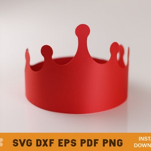 May include: A red paper crown with a simple design. The crown is made of a single piece of paper and has a rounded top.