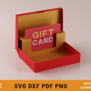 May include: A red and gold gift card holder with a slot for a gift card. The holder is open and the gift card is visible. The gift card says "Gift Card" in white letters on a red background.