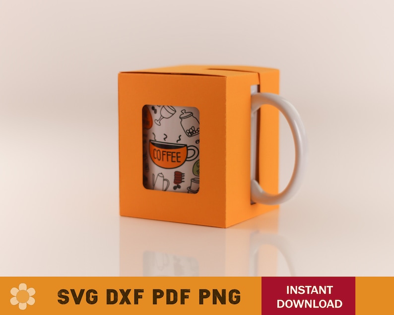 May include: Orange mug box with a white mug inside. The mug has a black and white design with the word "COFFEE" on it.