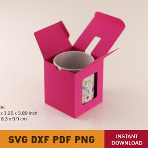 May include: A pink cardboard box with a cutout for a mug. The mug has a floral pattern. The box measures 3.25 inches by 3.25 inches by 3.89 inches.