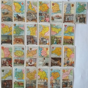 May include: A set of 24 vintage trading cards featuring maps of different regions of the United Kingdom and Ireland. Each card has a colorful map with a name of the region and a small illustration of a local industry.