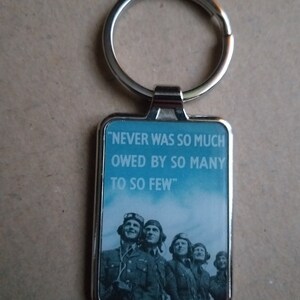 Never was so much owed by so many to so few - metal enamel collectible commemorative keyring keychain.