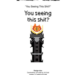 May include: A pixel art cross-stitch pattern of the Eye of Sauron from the Lord of the Rings. The pattern is black and grey with a red and orange eye. The text "You seeing this shit?" is above the pattern. The pattern is 9.4 cm wide by 16.5 cm tall.