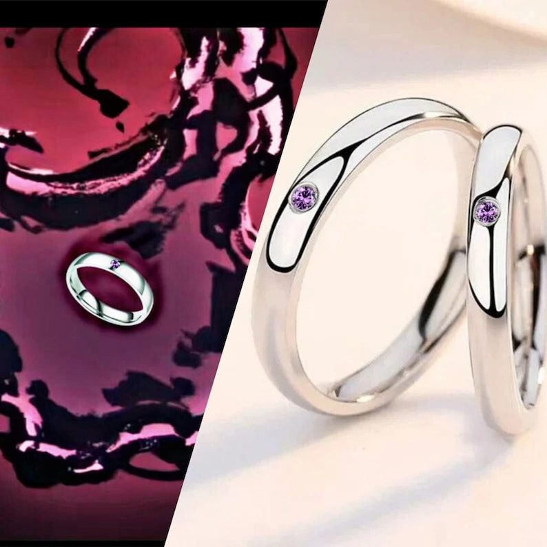 May include: Two silver rings with a small purple gemstone on each. The rings are side by side and the gemstones are facing each other.