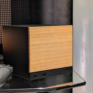 A solid wood lati faceplate for the 2026 Steam Machine, made from genuine wood.