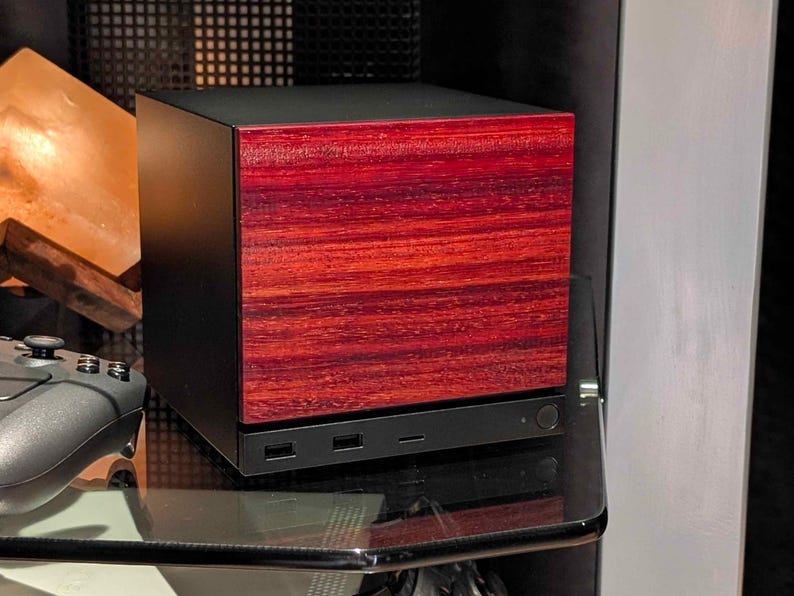A solid wood padauk faceplate for the 2026 Steam Machine, made from genuine wood.