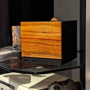 A solid wood canarywood faceplate for the 2026 Steam Machine, made from genuine wood.