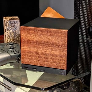 A solid wood sapele faceplate for the 2026 Steam Machine, made from genuine wood.