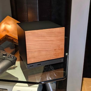 A solid wood cherry faceplate for the 2026 Steam Machine, made from genuine wood.