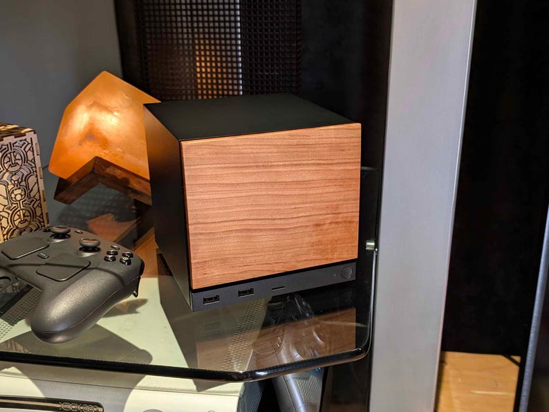 A solid wood cherry faceplate for the 2026 Steam Machine, made from genuine wood.